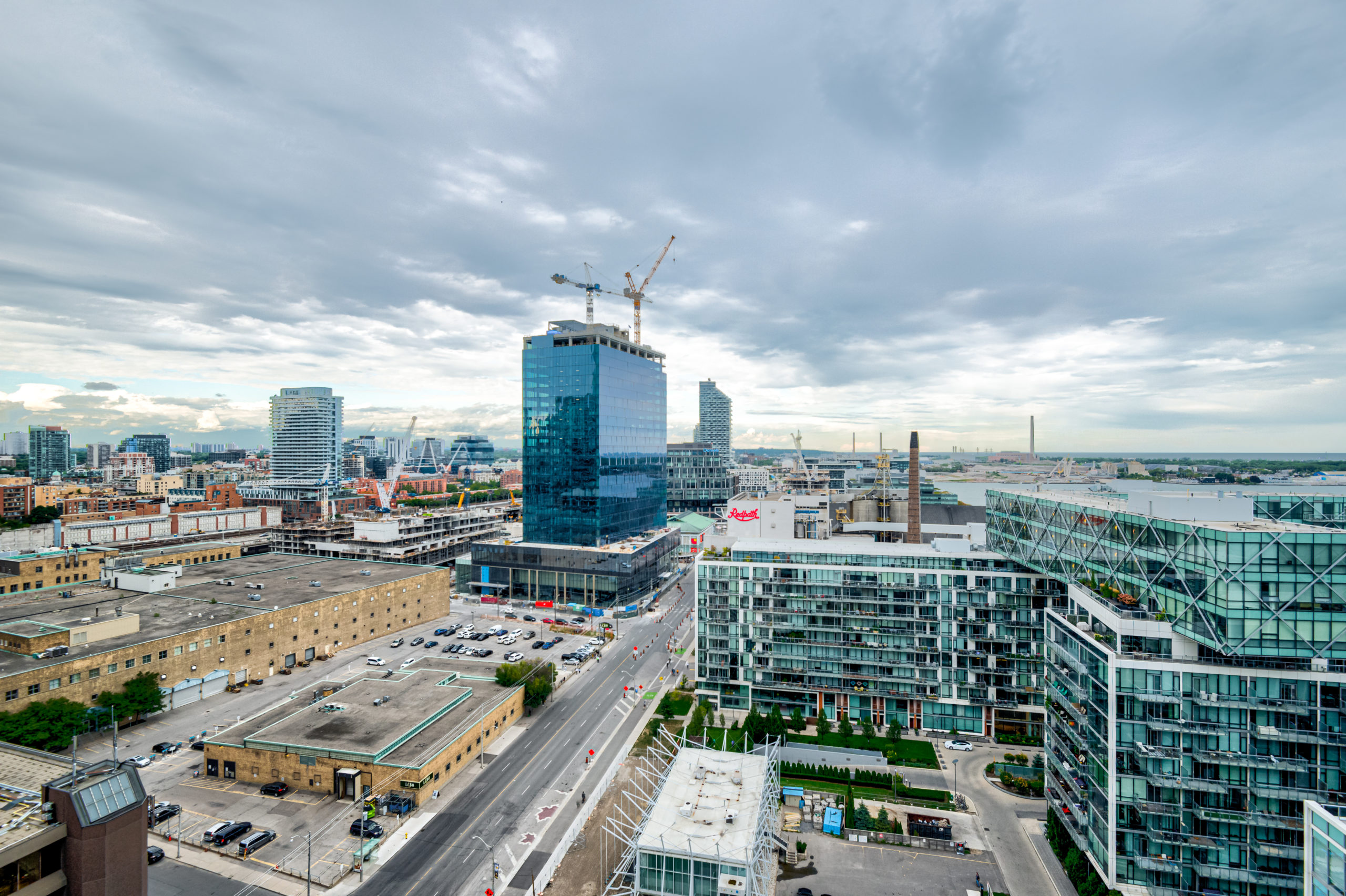 View of streets and buildings from 15 Queens Quay E Unit 1901 balcony.