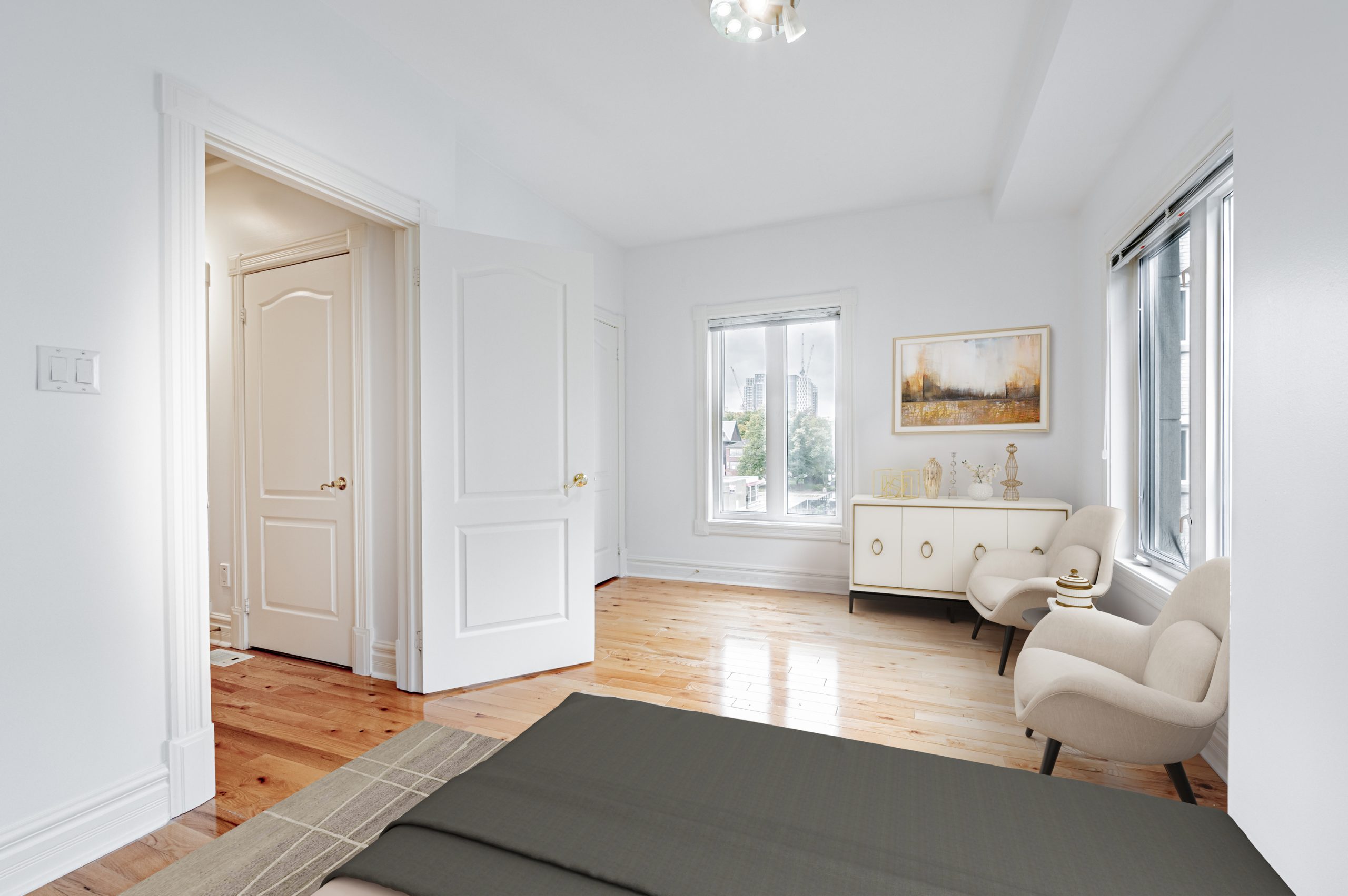 Bedroom hardwood floors gleaming under sunlight from window.