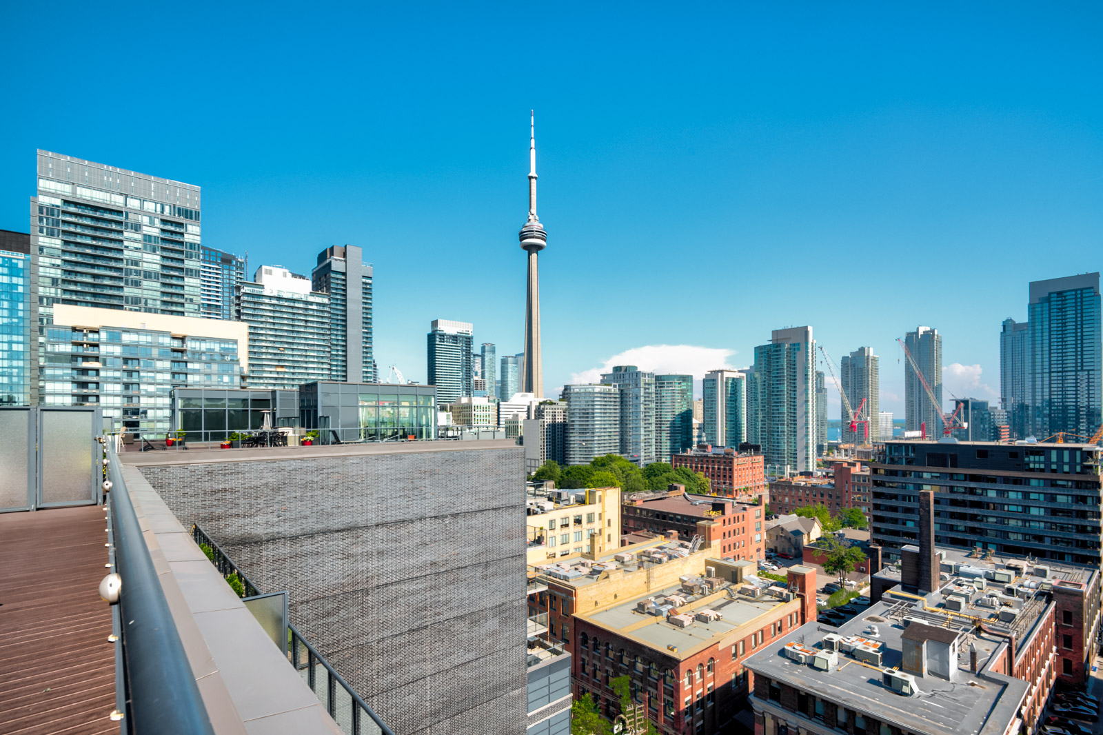 View of CN Tower and Toronto from terrace of Victory Lofts Penthouse Suite in 478 King St W Toronto.