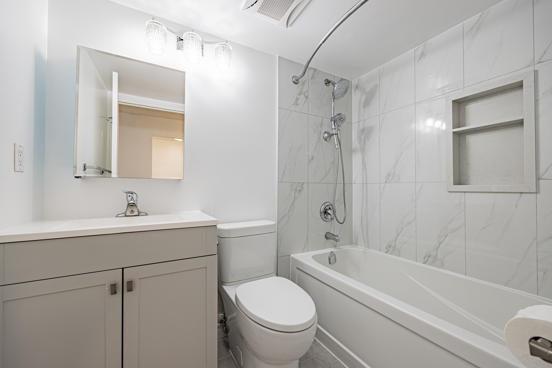 Newly renovated bathroom with porcelain floors – 120 St Patrick Unit 807.