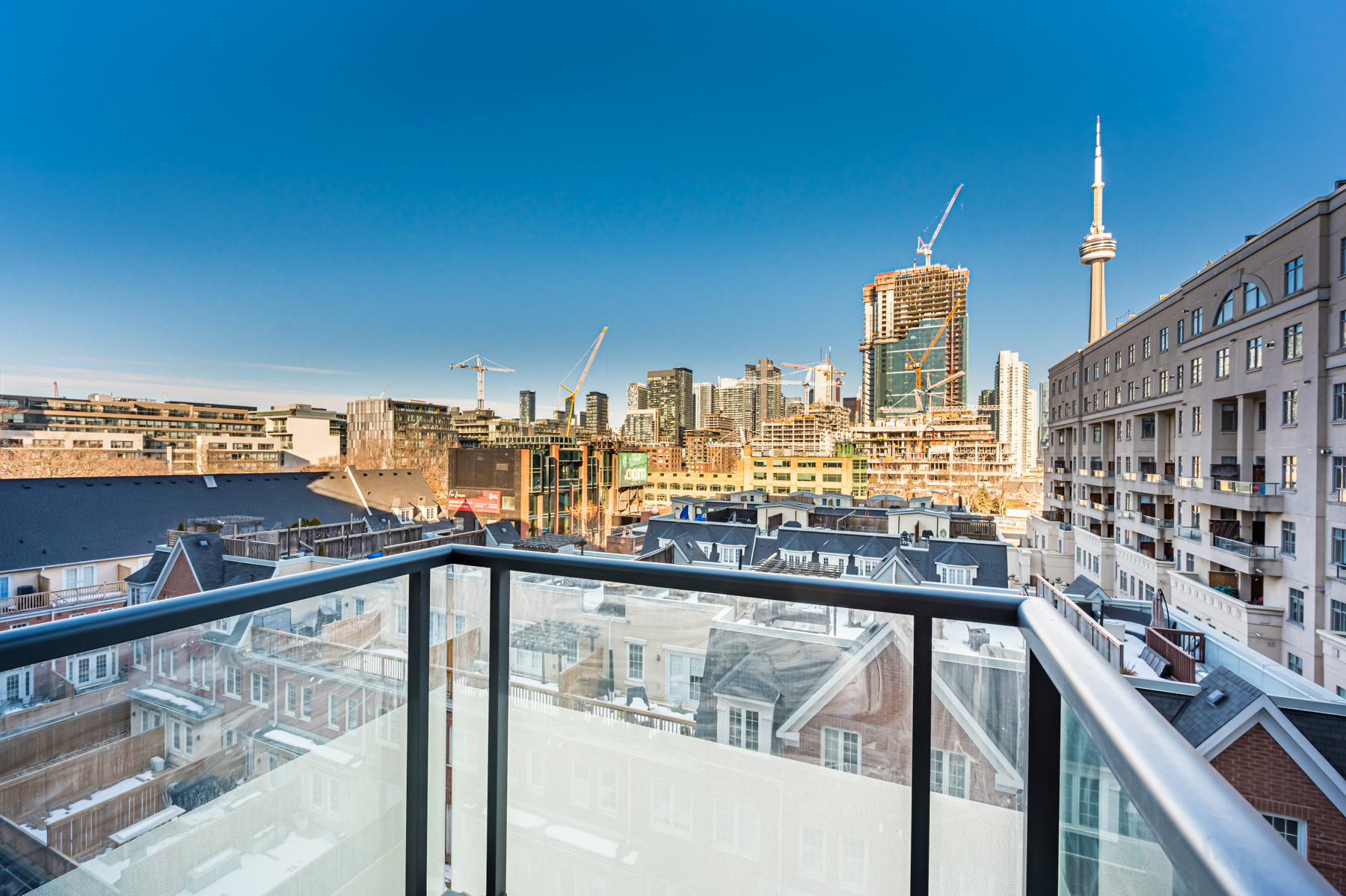 560 Front St W Unit 622 balcony with view of houses, condos and CN Tower in distance.