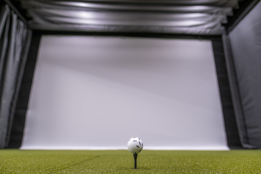 Close up of golf ball and screen.