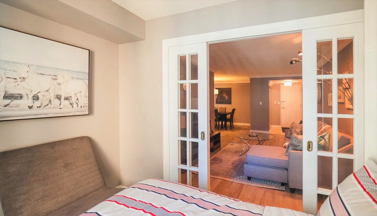 French doors with view of living room of 168 Simcoe St.