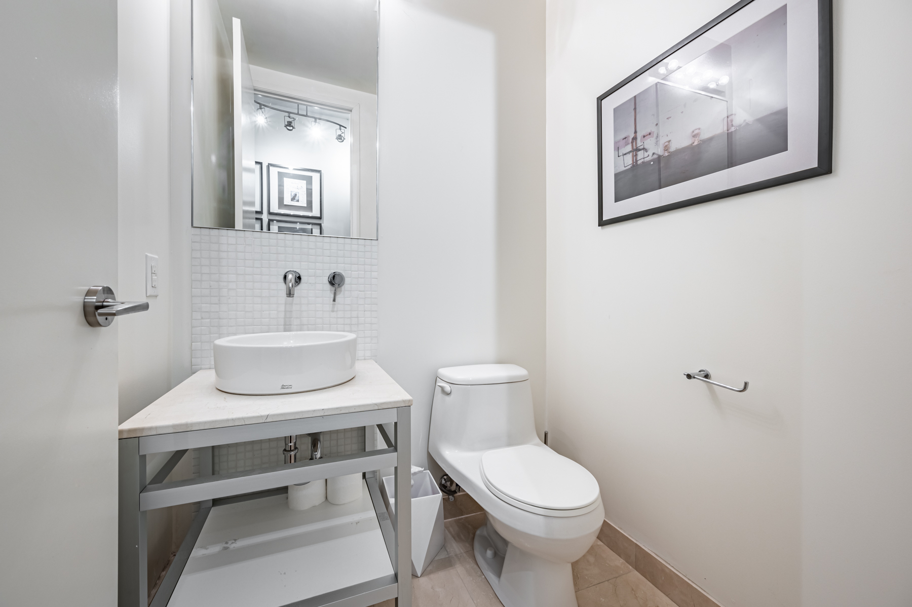 Powder room with raised vessel sink bowl – 380 Macpherson Ave Suite 517.
