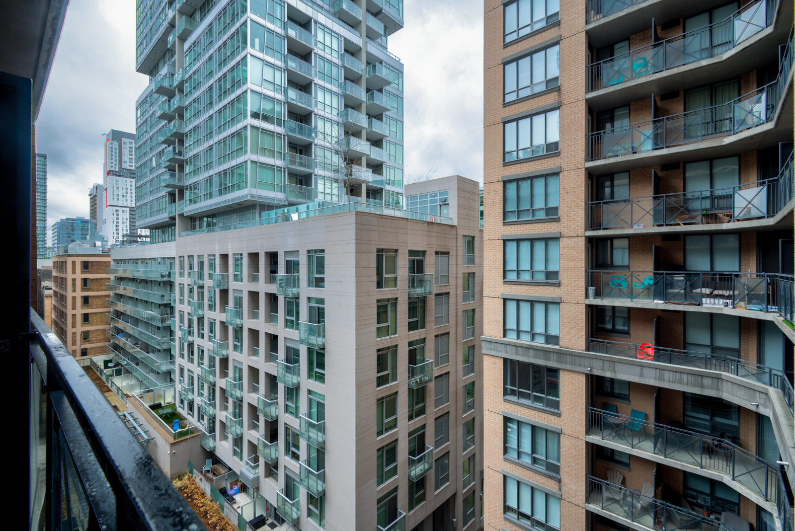 View of neighbouring buildings from balcony of 140 Simcoe St E Unit 921.