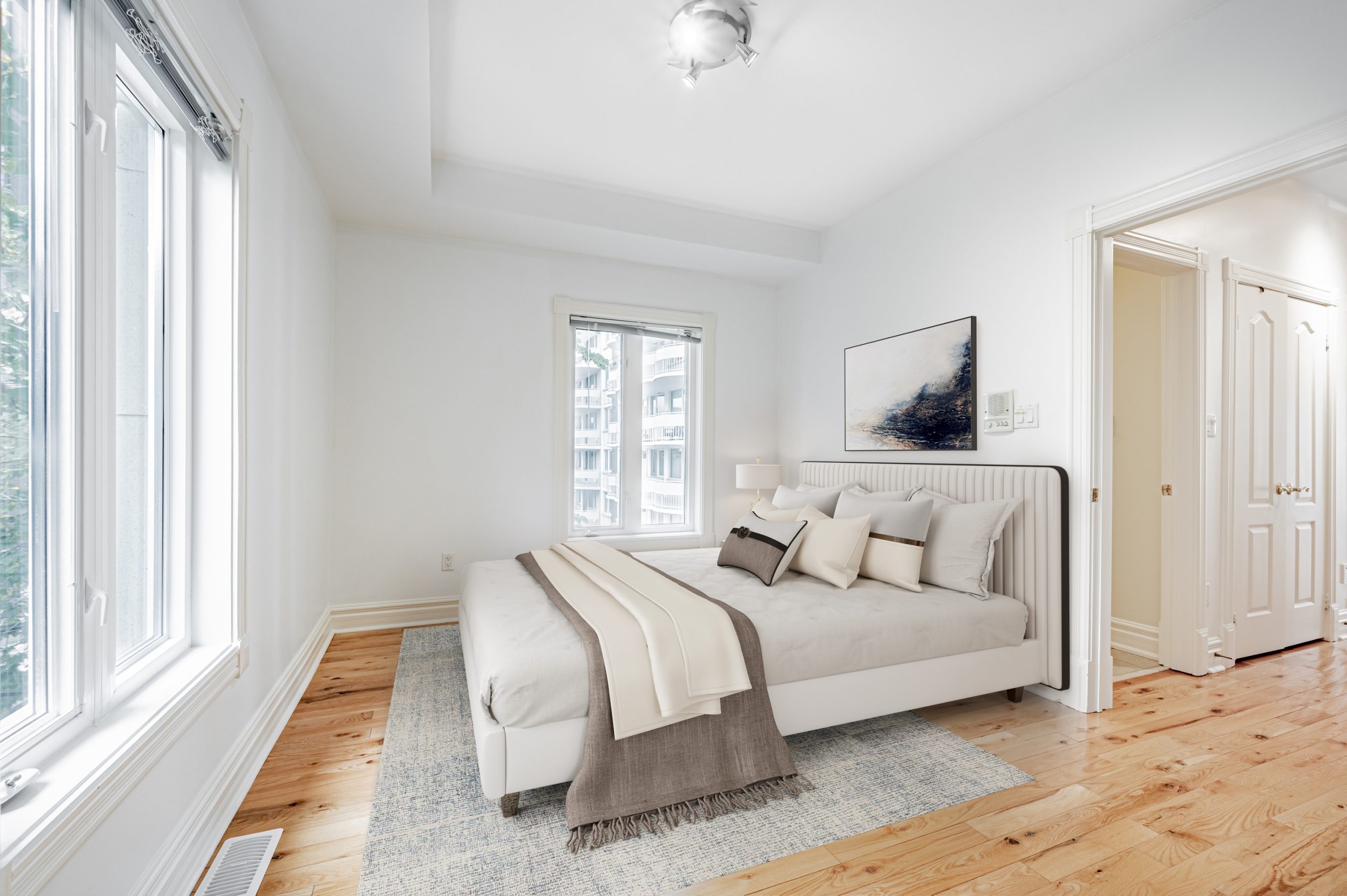Smaller second floor bedroom with hardwood floors and modern lighting – 23 Annex Lane.