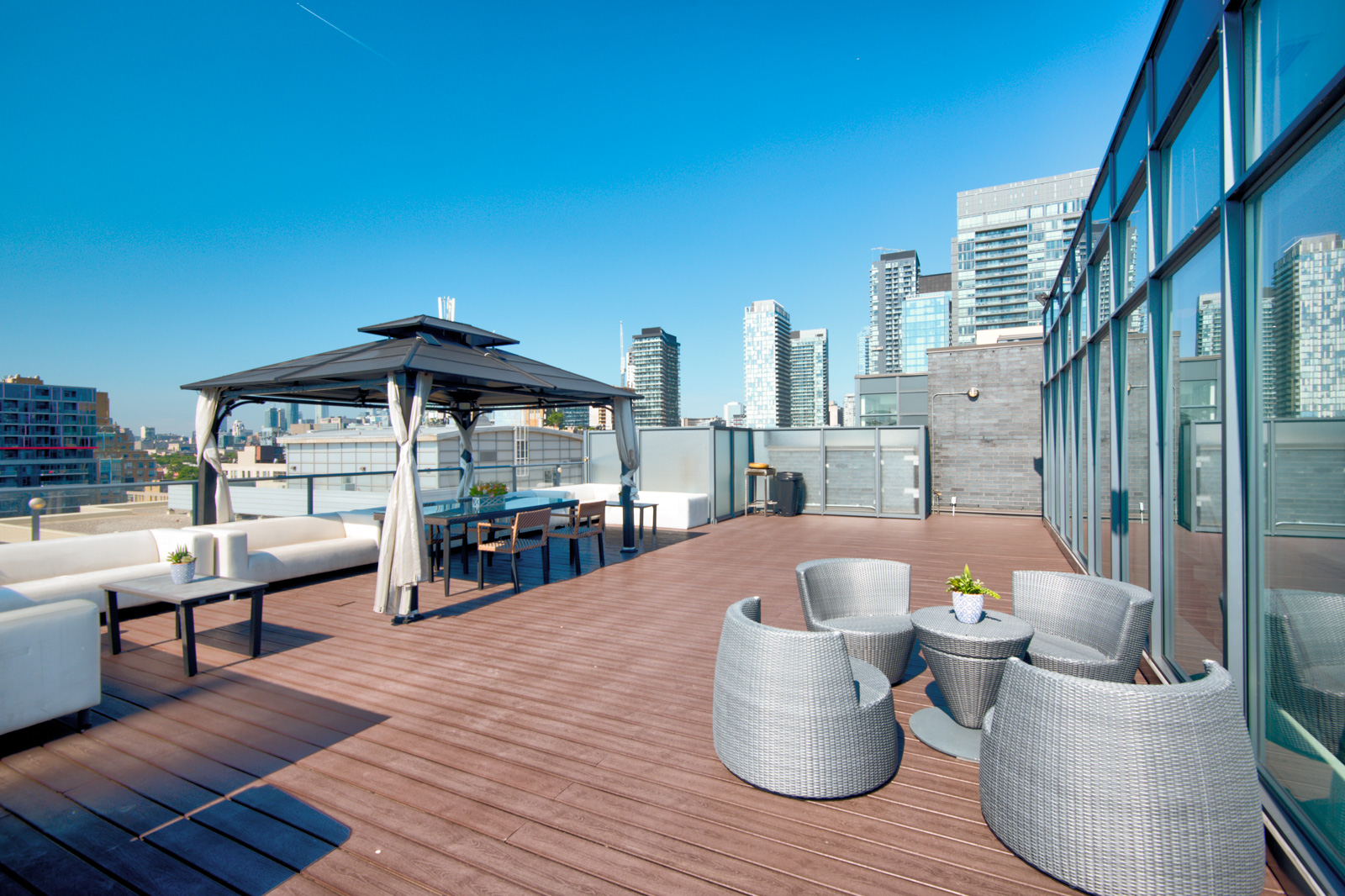 Terrace and deck with furniture - Victory Lofts Penthouse Suite in 478 King St W Toronto.