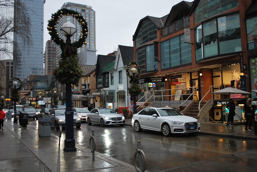 Rainy day and cars at Cumberland St in Yorkville, Toronto.