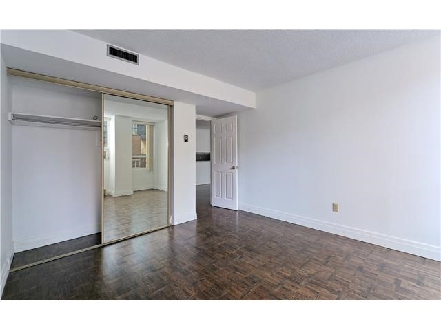 Photo showing closet with sliding mirror door