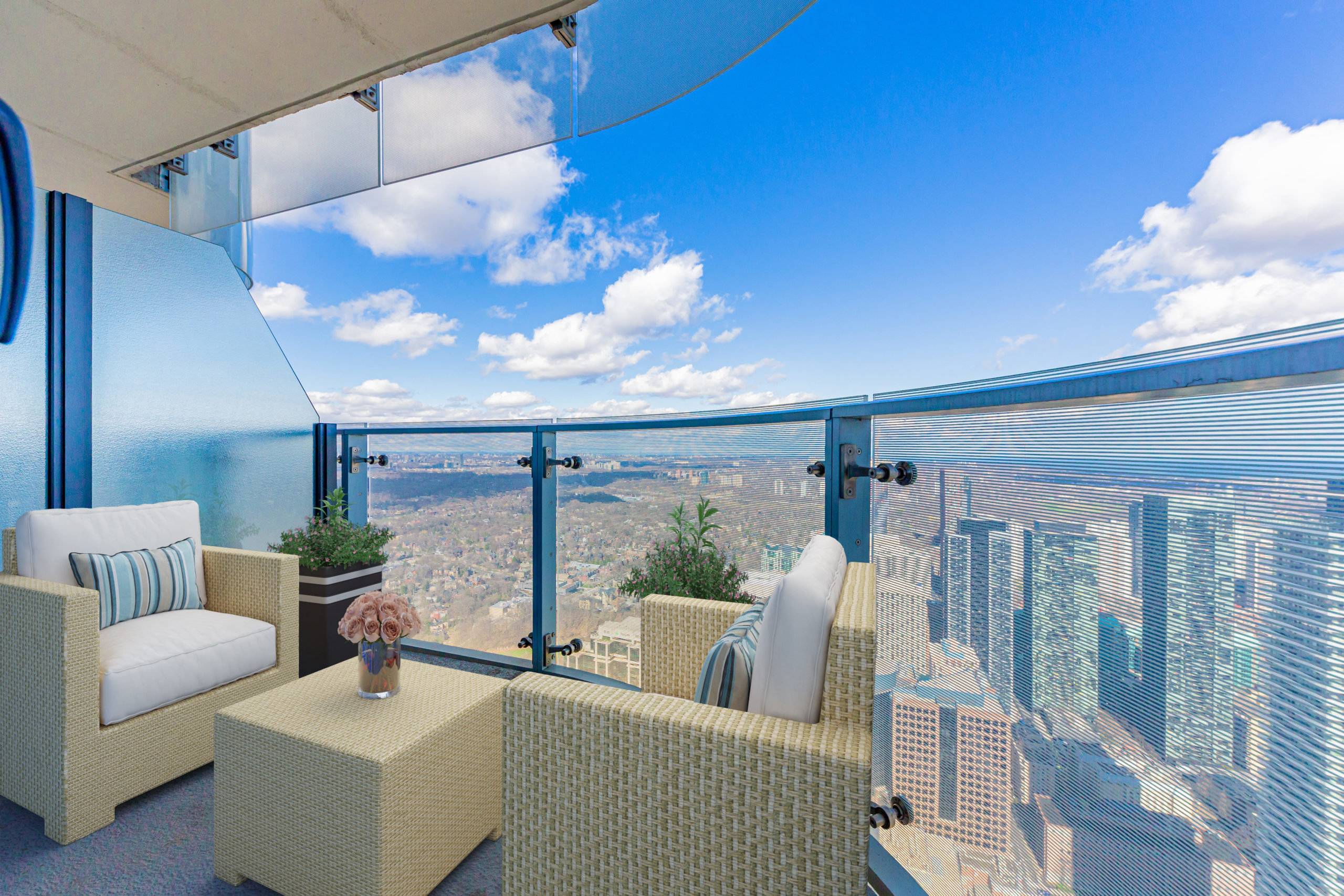 Condo balcony with dividers and glass panels.