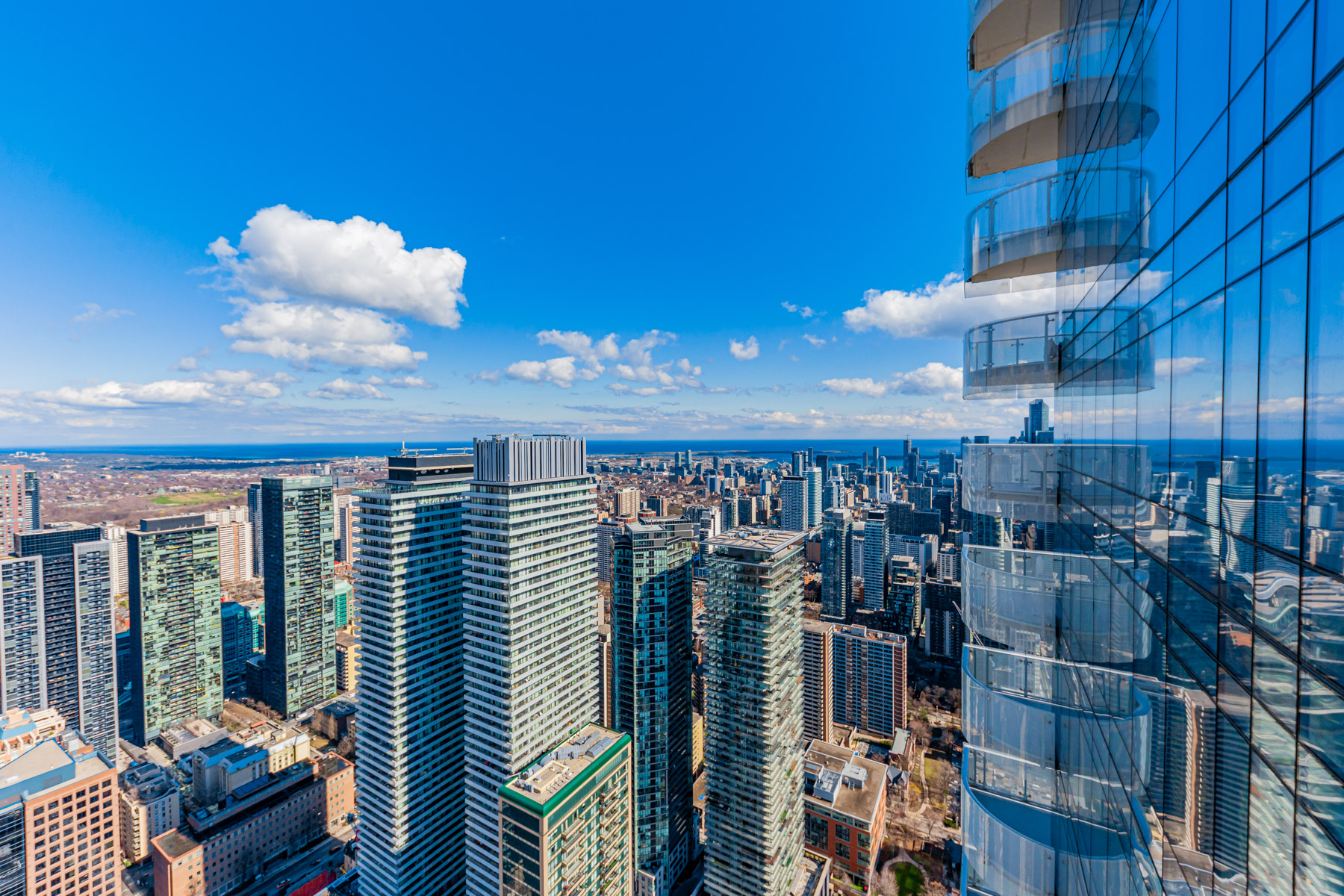 View of downtown Toronto and Lake Ontario from condo balcony.