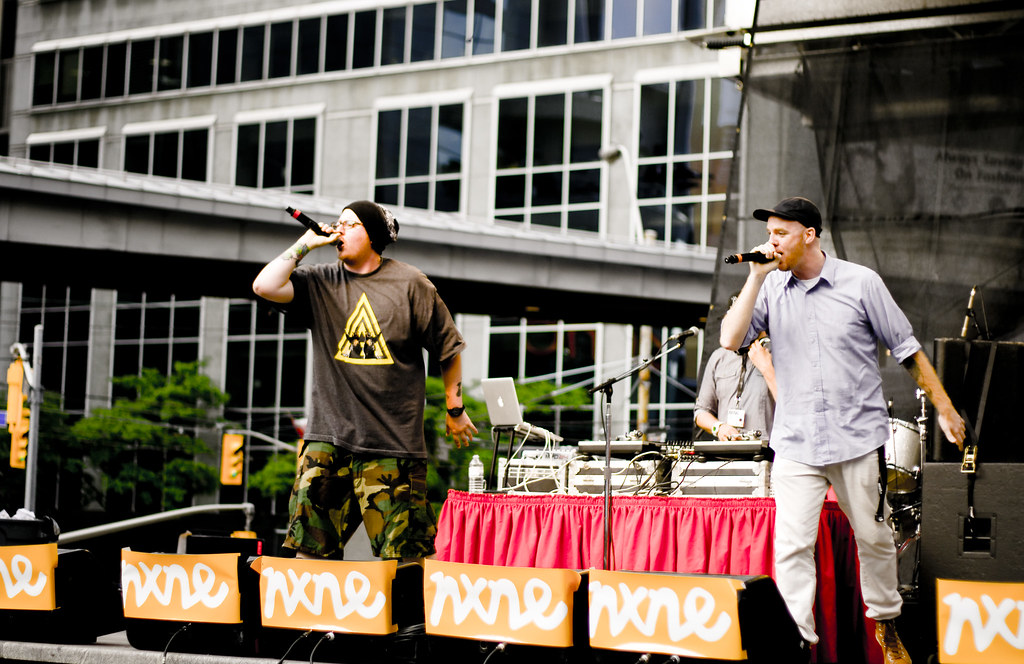 Two musicians on stage at NXNE concert in Yonge-Dundas Square.