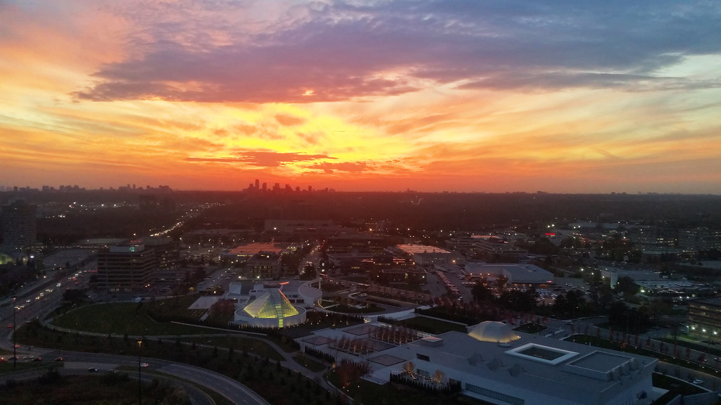 Ariel view of North York, Toronto at sunset with orange and yellow skies.