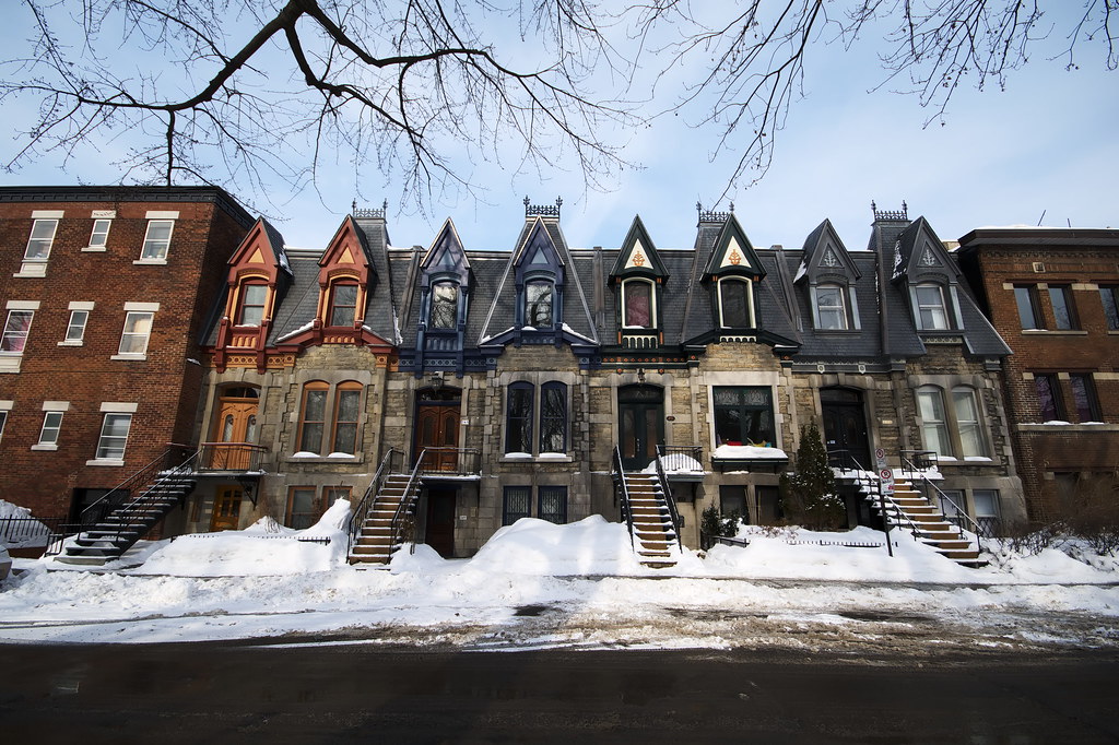 Victorian row houses with snow-covered pavements,