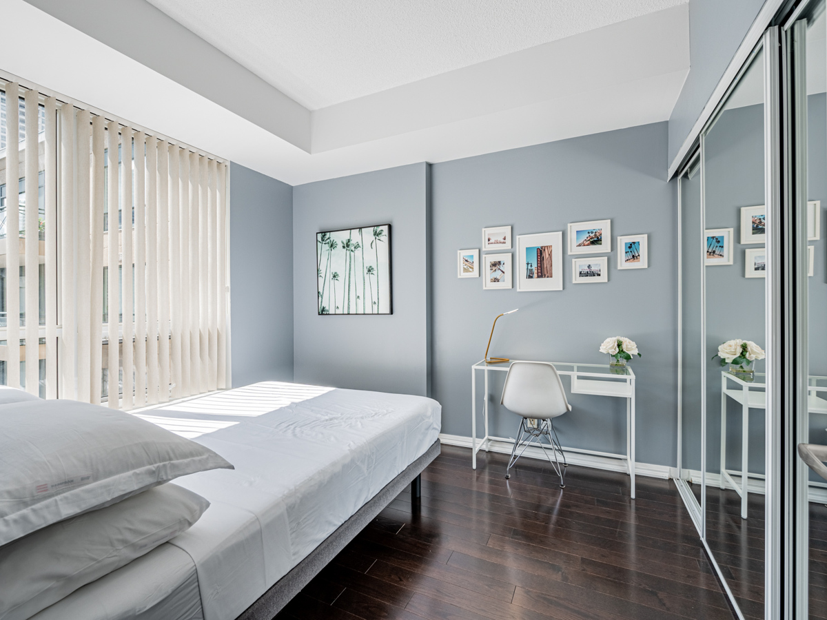 Condo bedroom with home office.