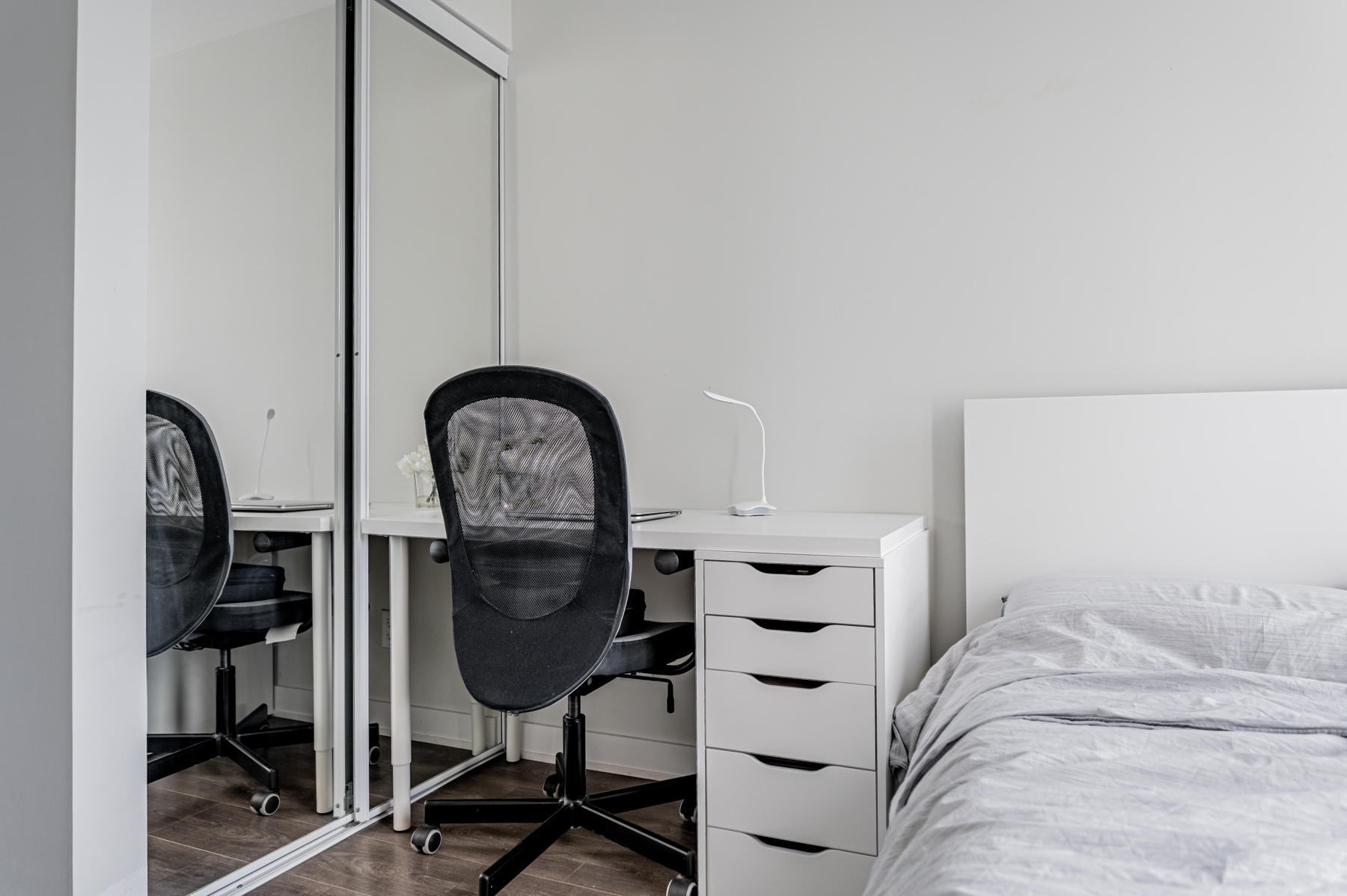 Condo bedroom with work desk.