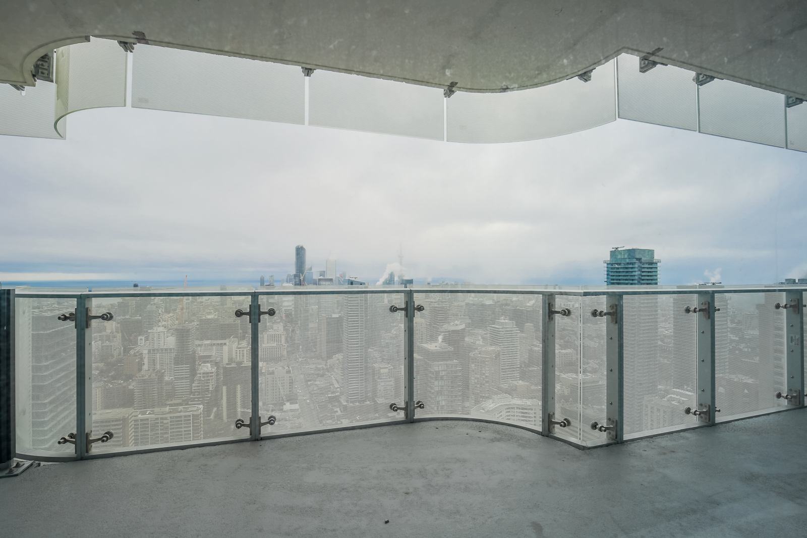 This wide balcony is perfect for entertaining guests or gazing at the city below