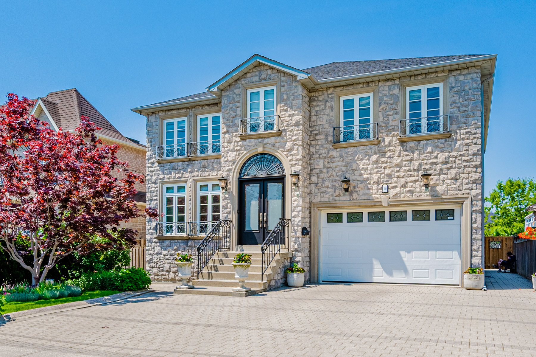 House with paved driveway.