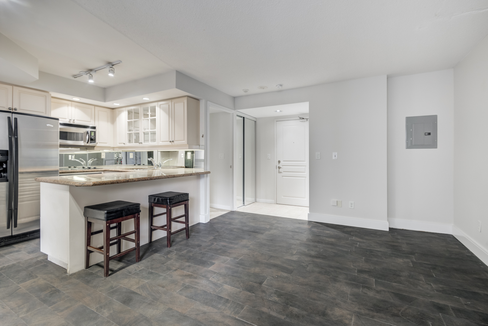 Empty condo with newly painted gray walls.