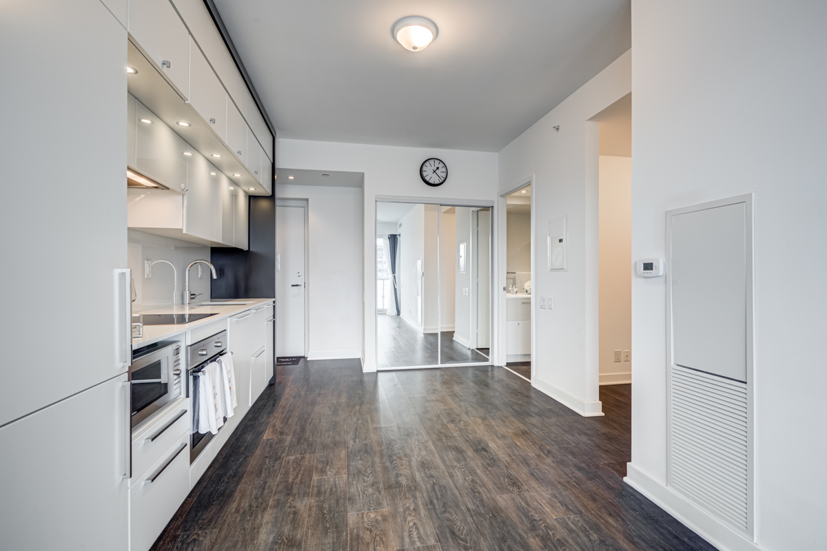 Condo with reflective mirror door closet.