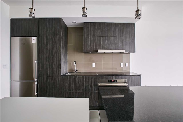 This image shows 1 Bloor Unit 3109 kitchen, appliances, lights and island.