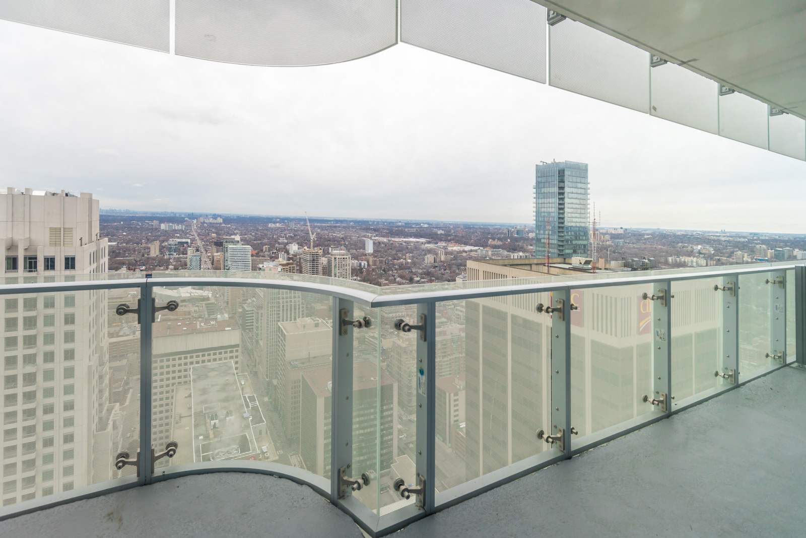 Photo of balcony showing Toronto in the distance.