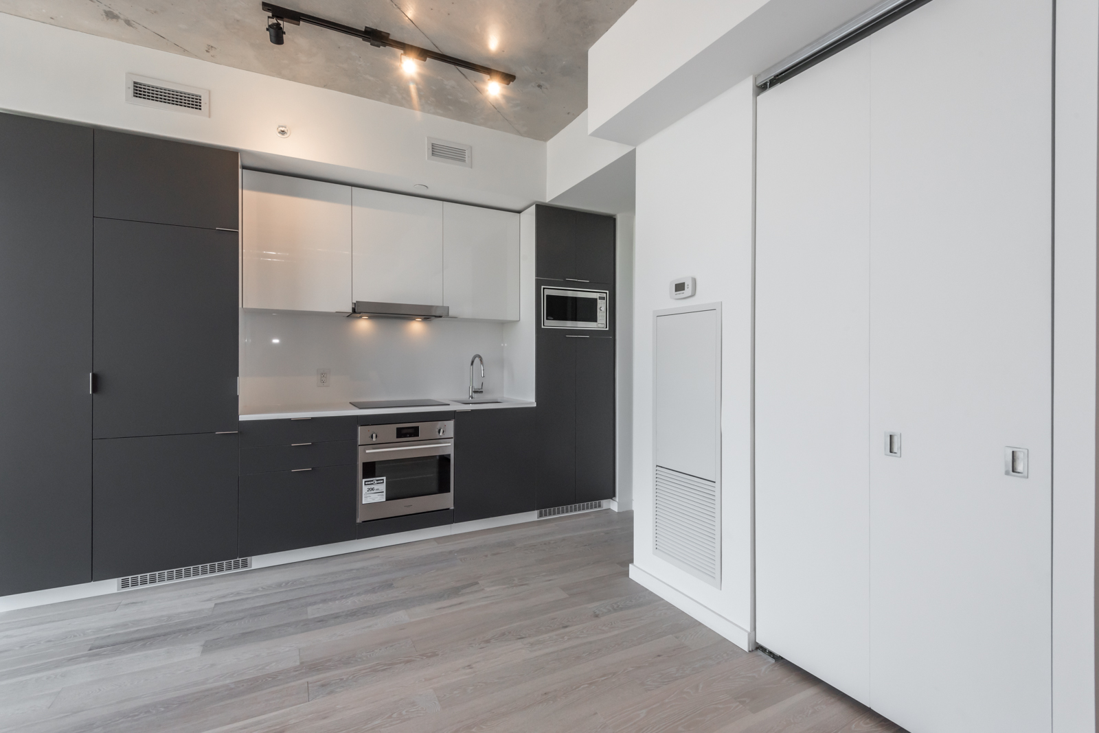 This image shows the kitchen and its beautiful cabinets.