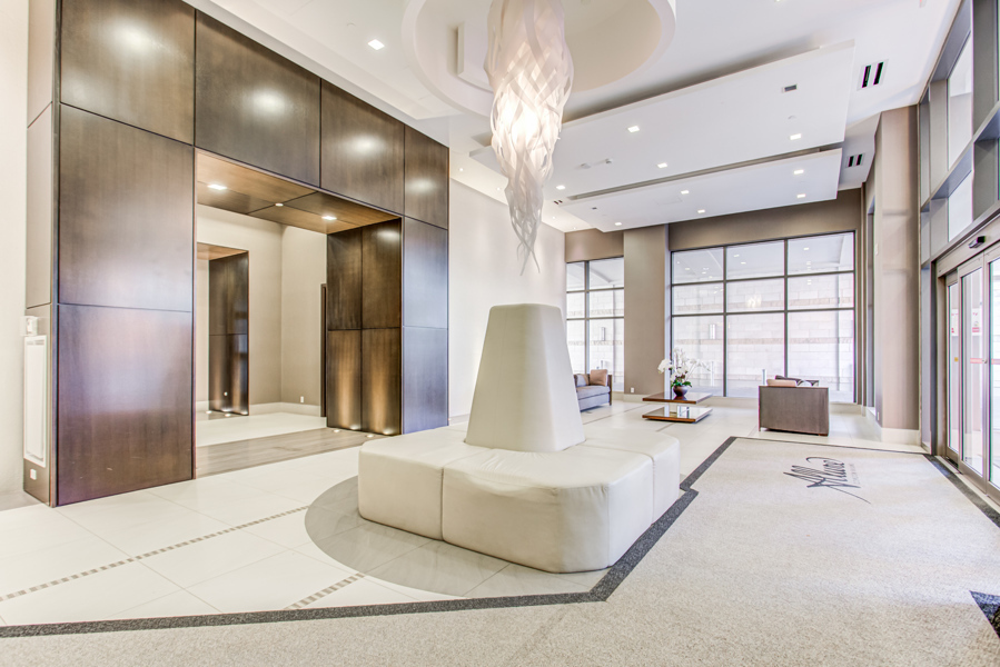 Allure Condos – sophisticated lobby with chic lighting and furniture.