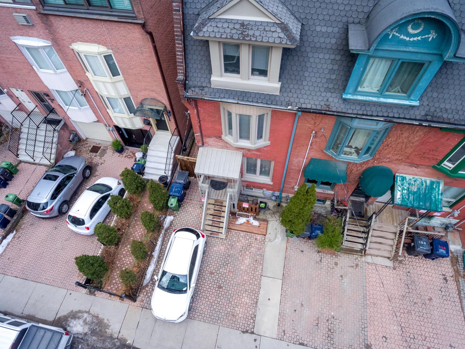 Drone photo of 120 McGill St, a red-brick Victorian house.