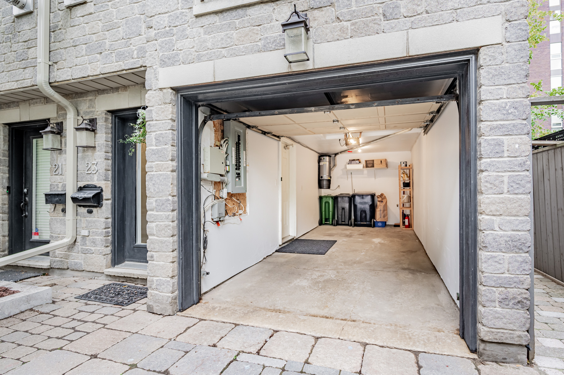 23 Annex Lane newly painted garage with automatic door and side entrance to house.