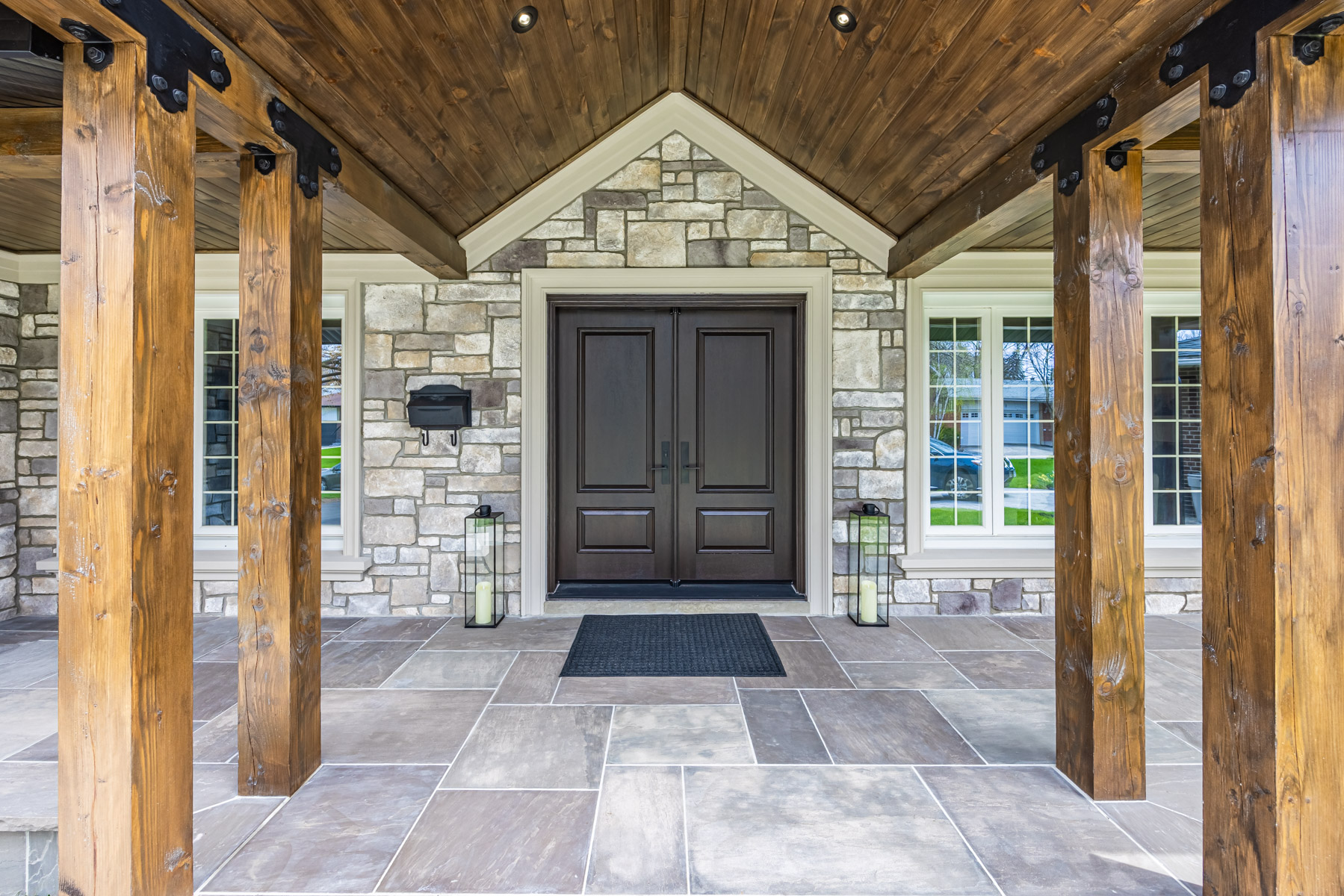 Gabled walkway with recessed lights.