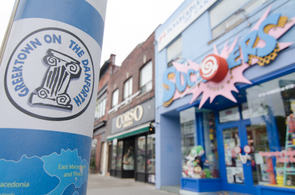 Close up of street lamp with poster of Danforth Avenue (Greektown Toronto).