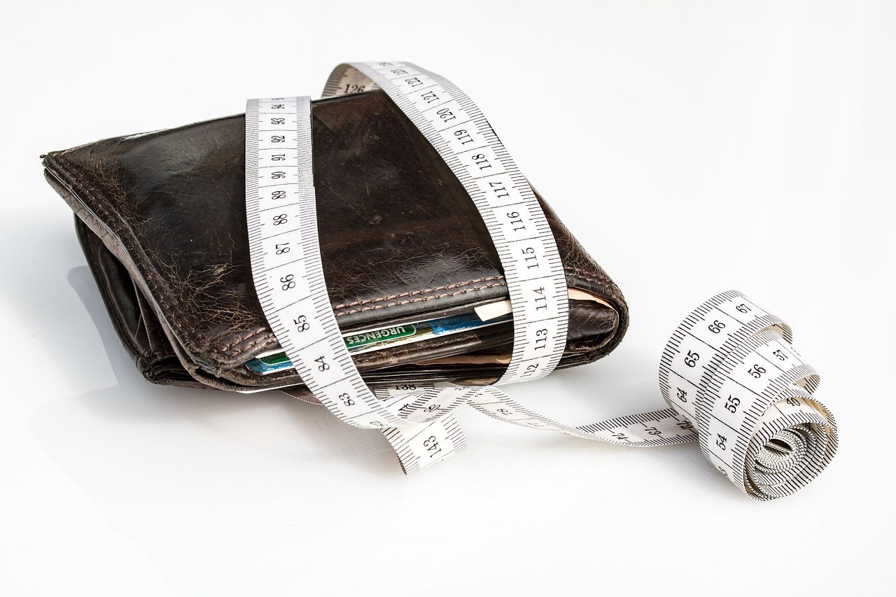 Pre-Listing Tip for sellers about budget and estimates with wallet and measuring tape.