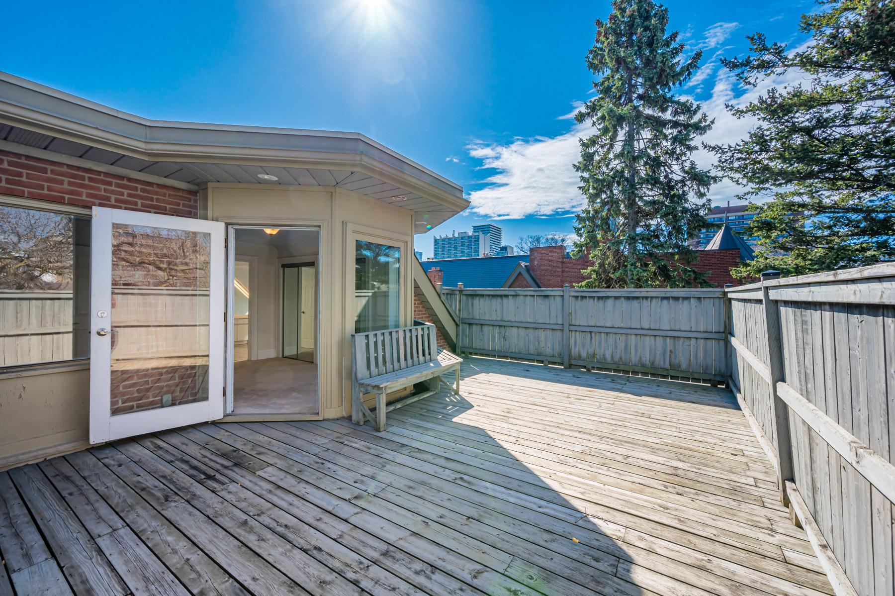 Large wood deck on third floor of 98 Bedford Rd.