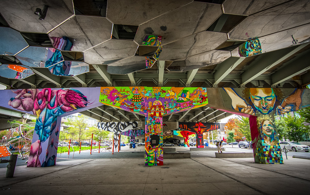 Colourful graffiti on concrete columns in Toronto's Underpass Park.