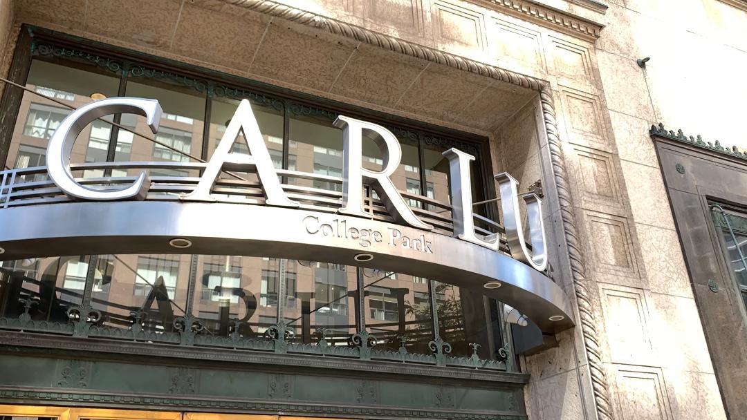 Closeup of The Carlu sign over door.