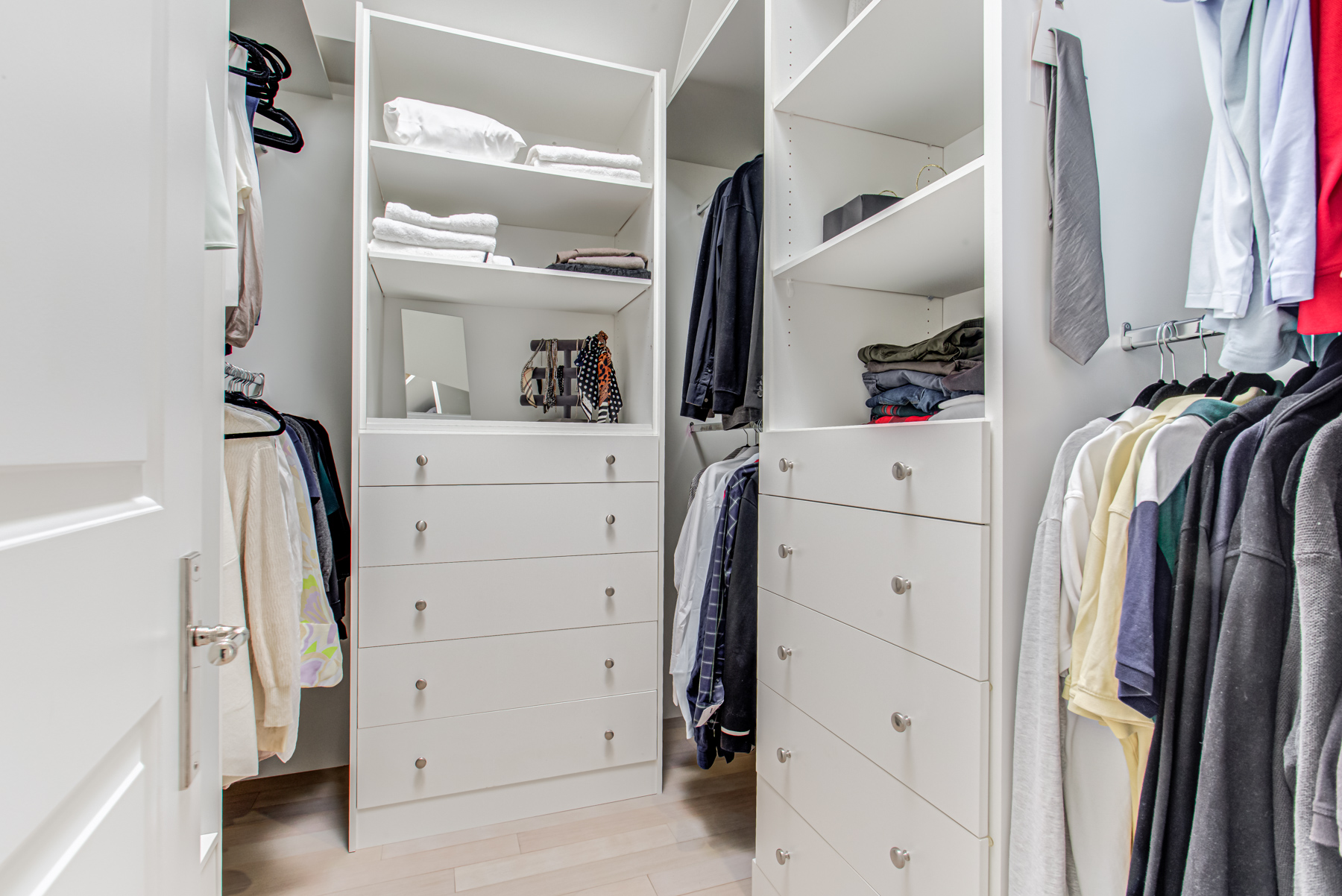 741 Glencairn Ave walk-in closet with cabinets and drawers full of clothes.