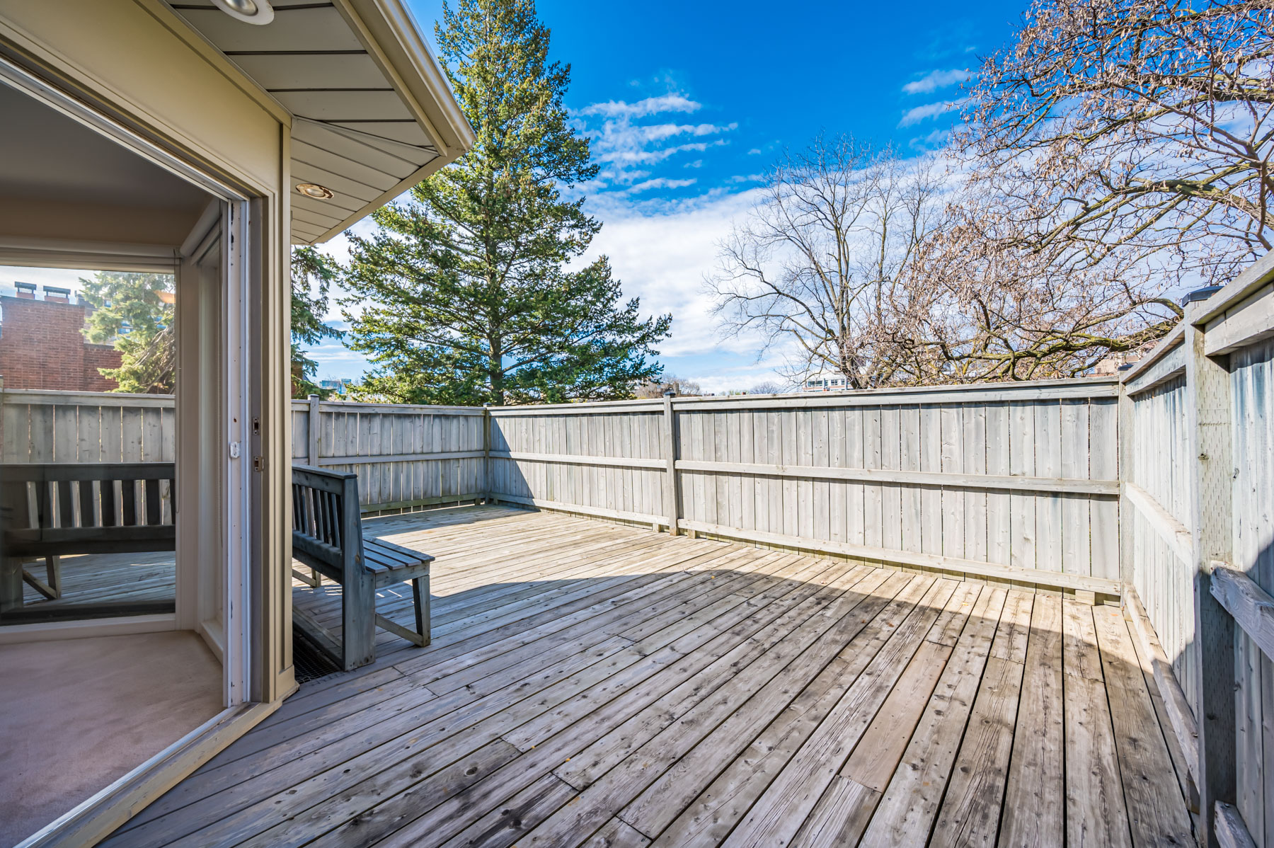 Wood deck with walls and recessed lights.