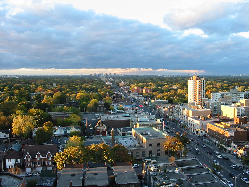 Ariel view of Midtown Toronto showing tree tops, streets and buildings. 