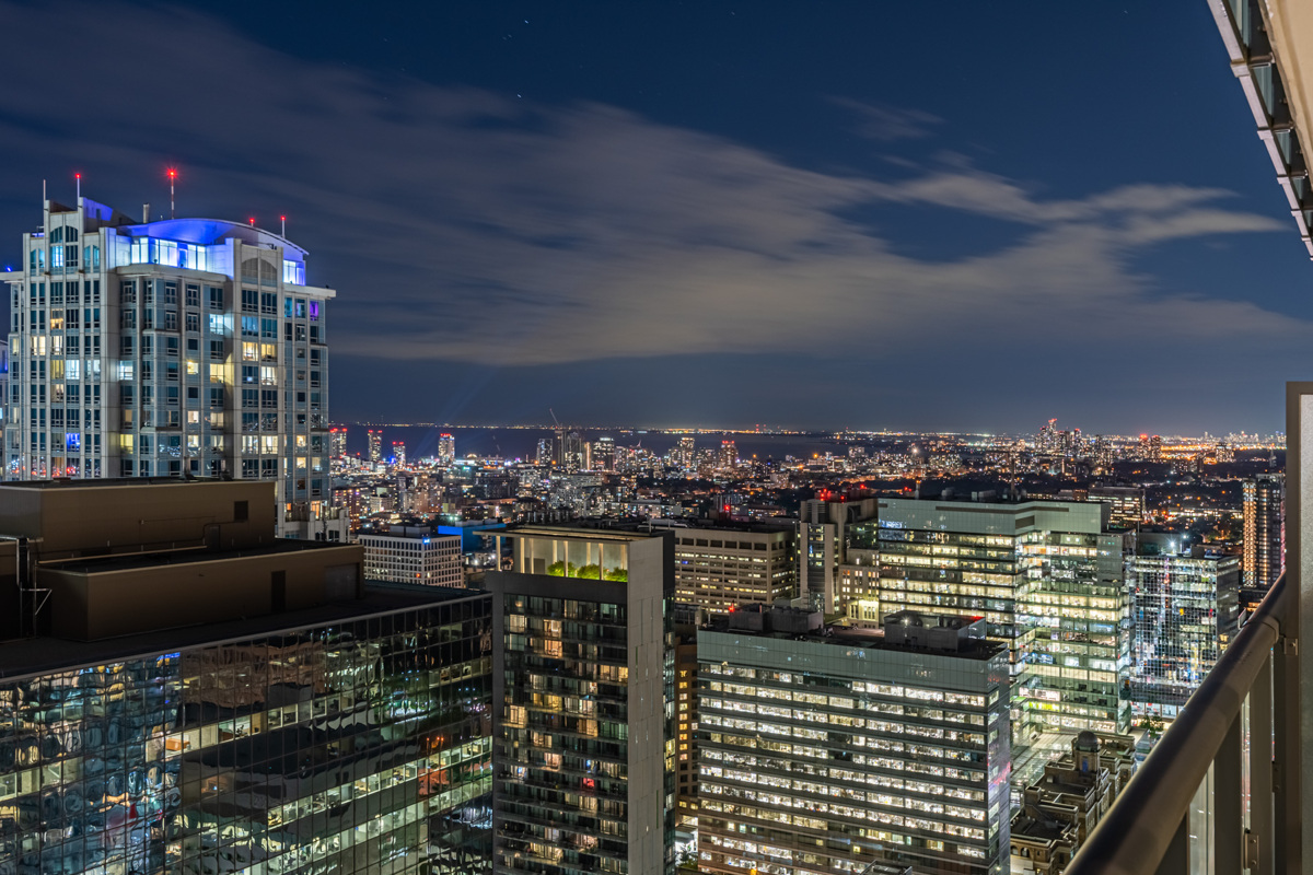 Sky view of Toronto and Lake Ontario at night.