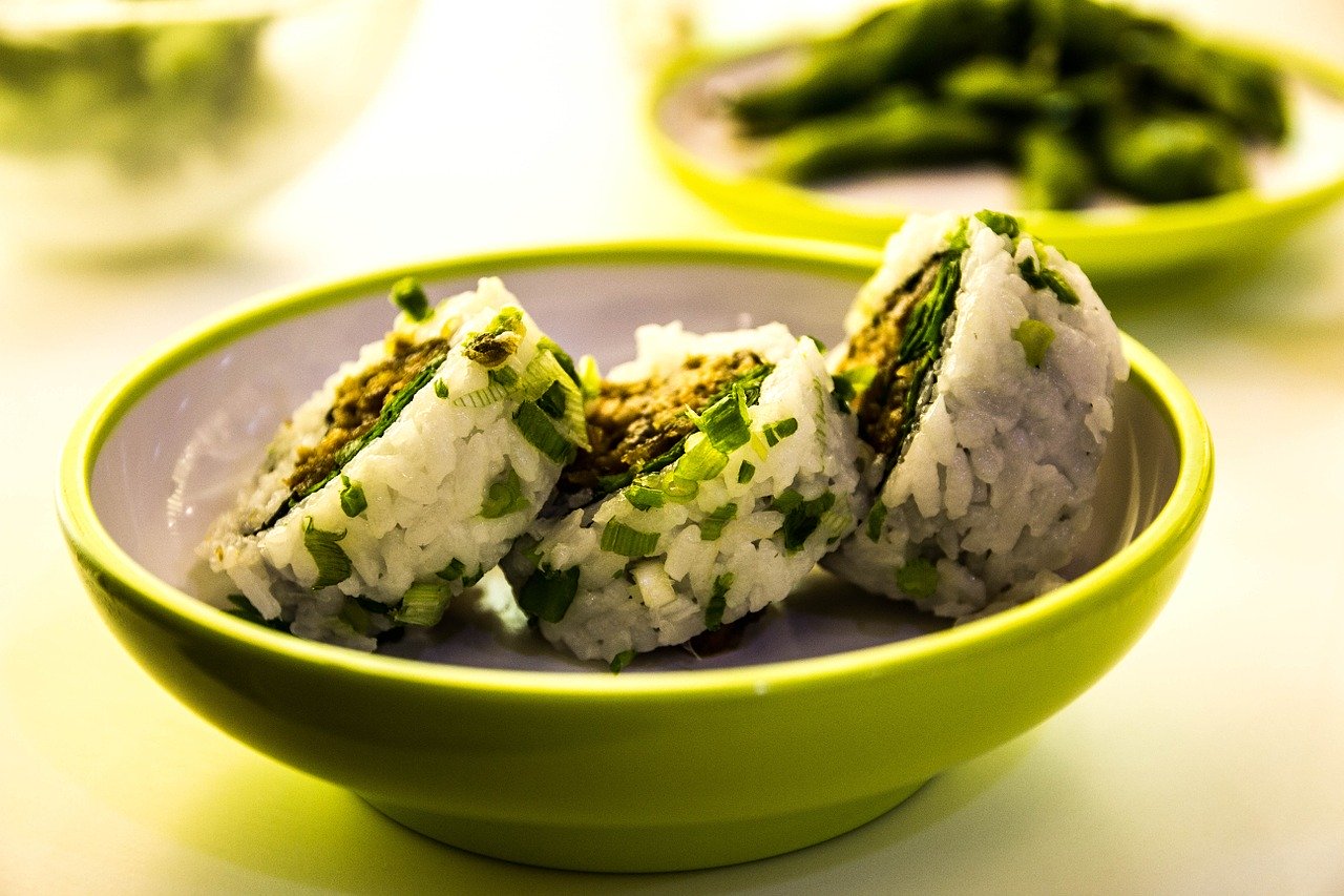 Sushi in green bowl.