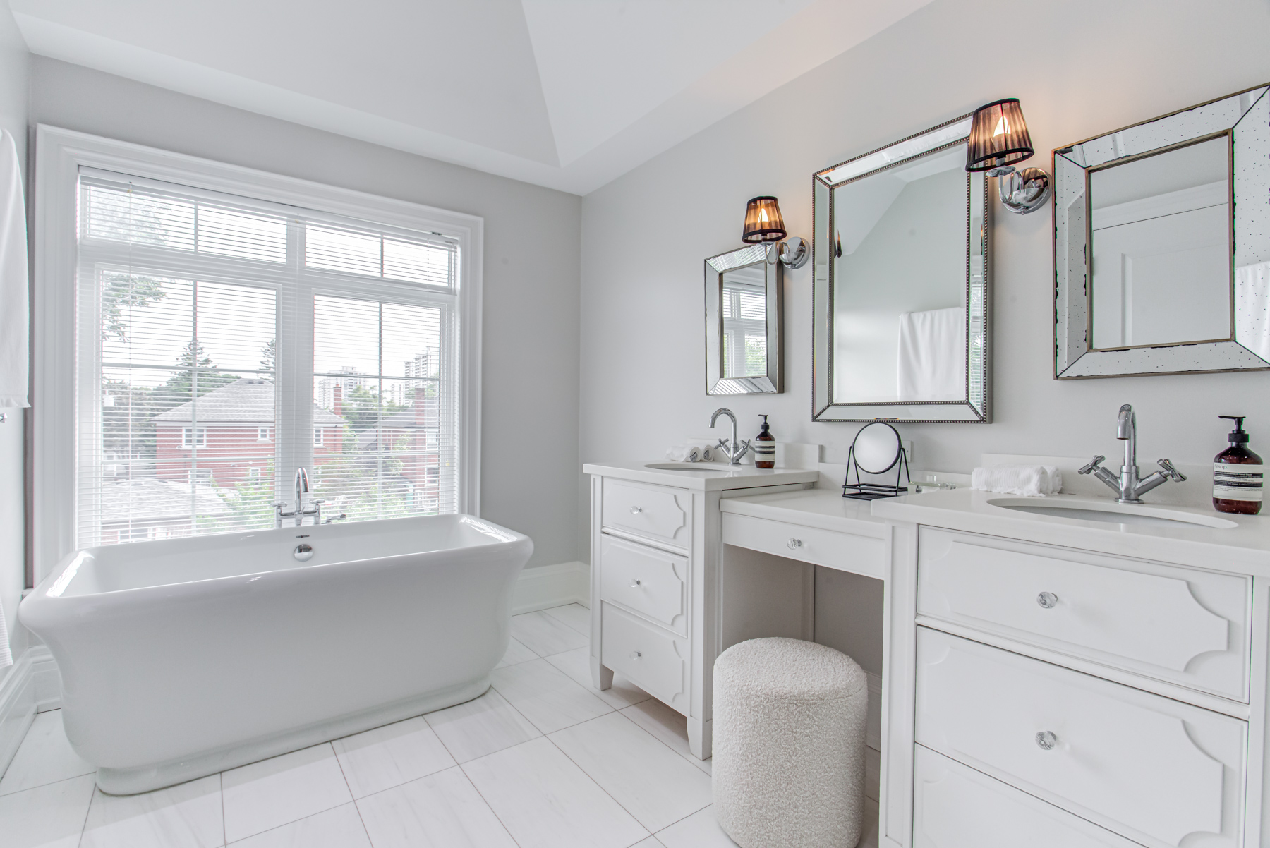 Beautiful 6-piece bath with large vanity and freestanding soaker tub.