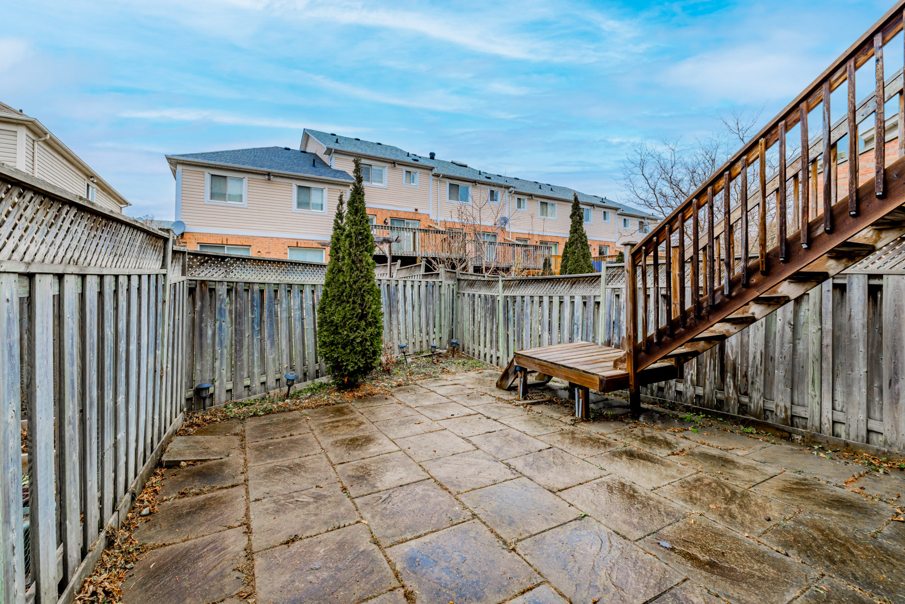 Large backyard with fence.