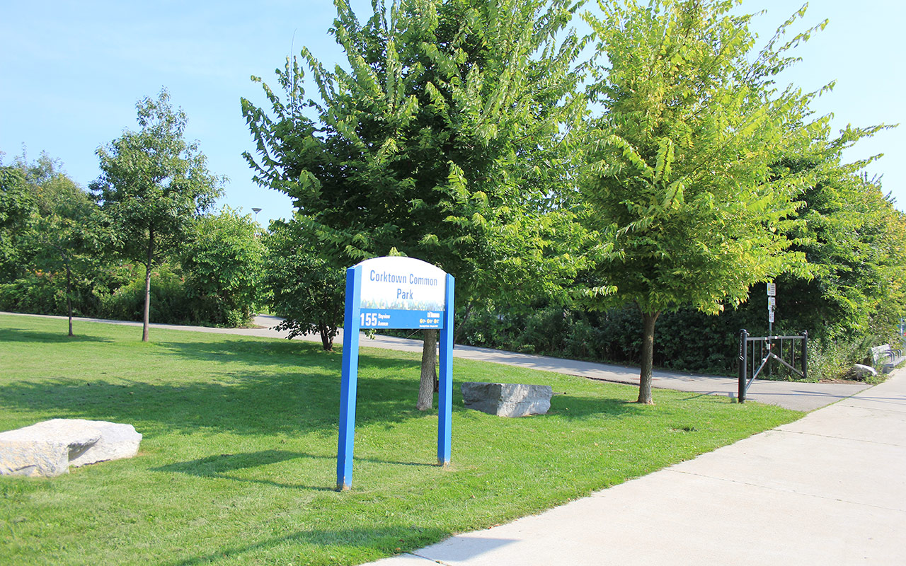 Sign on grass saying Corktown Common Park.