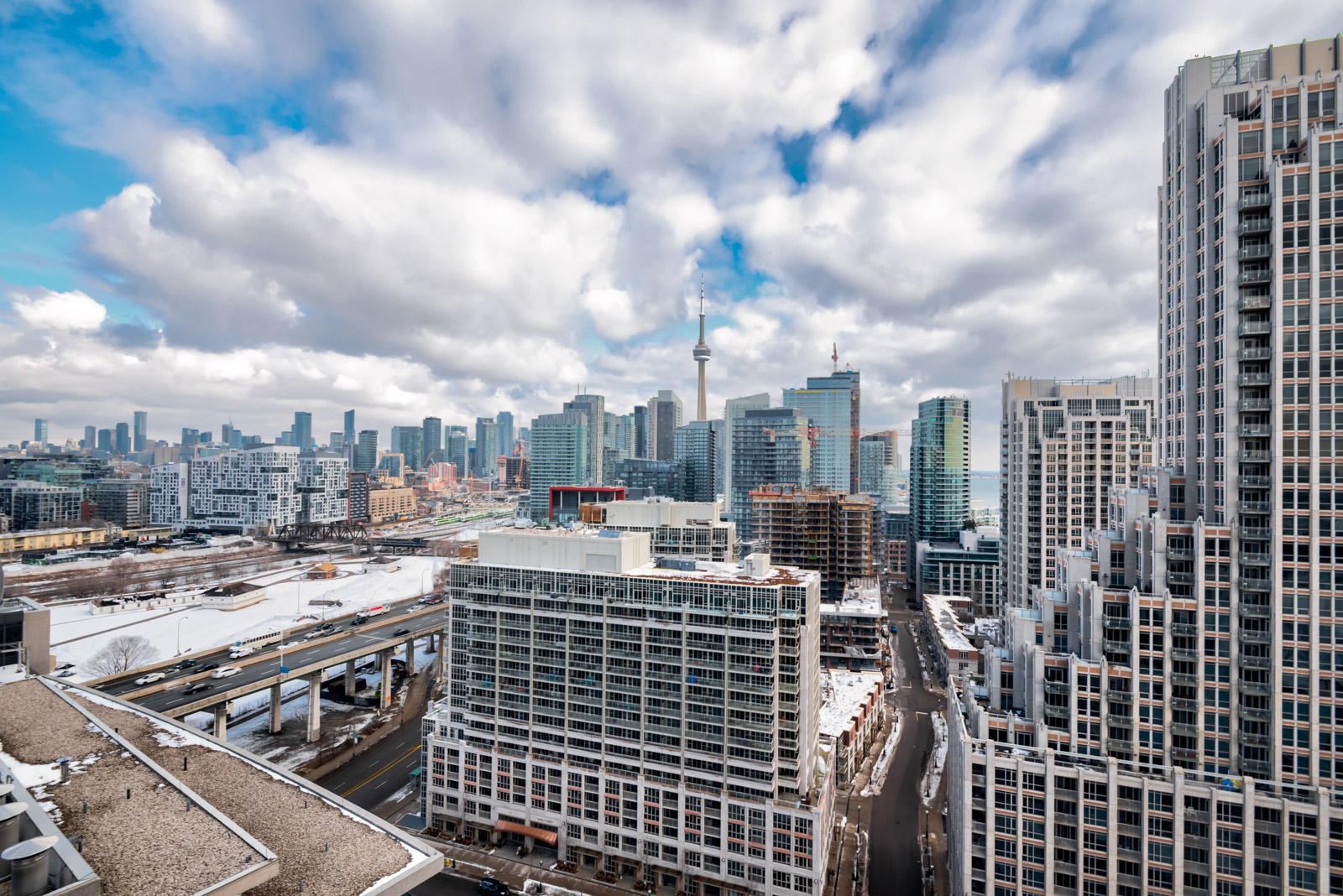 Daytime view of CN Tower and downtown Toronto from 215 Fort York Blvd Unit 2310 balcony.
