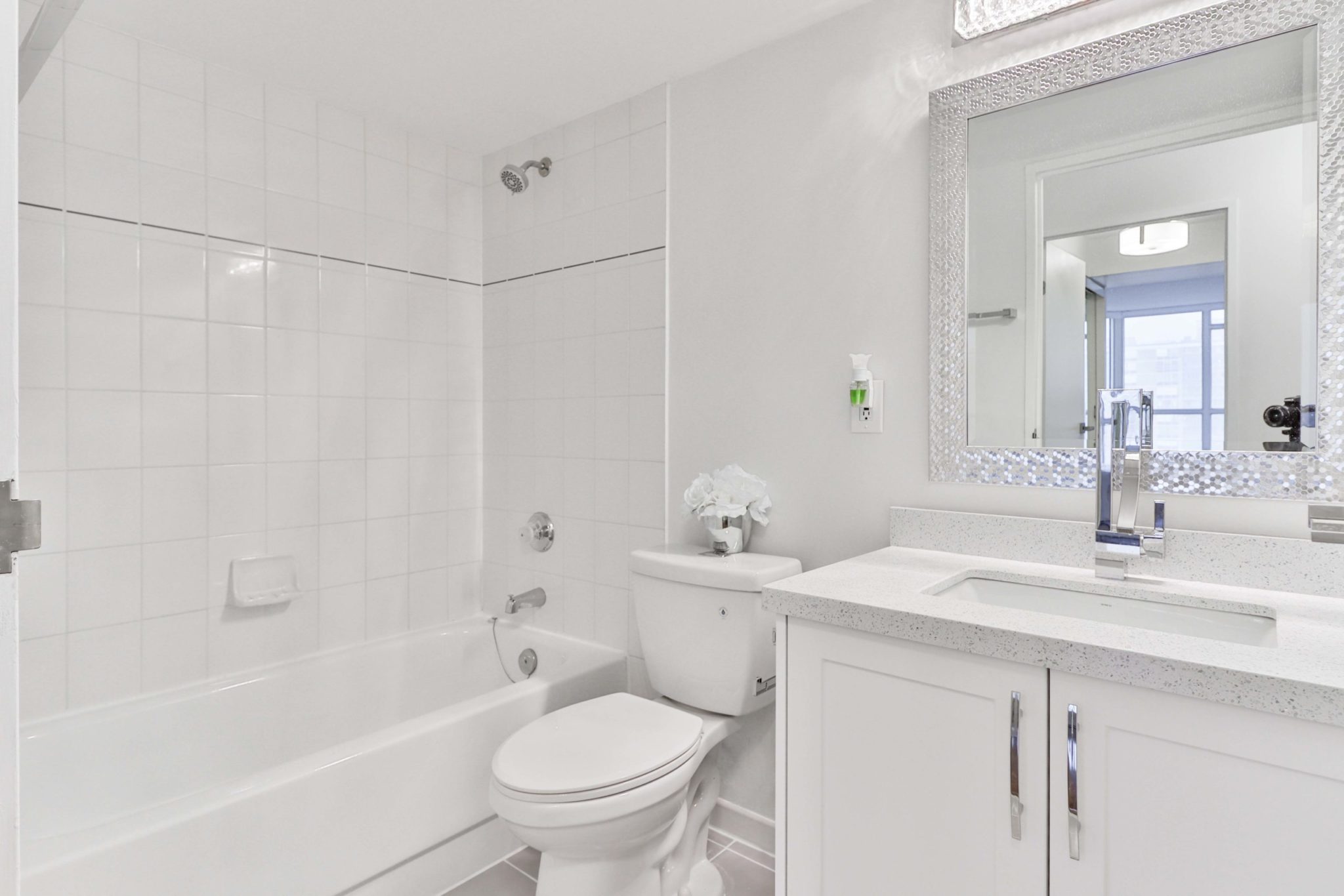 Fully-renovated 3-piece bath with new shower, tub, sink, toilet, cabinets and quartz counters.