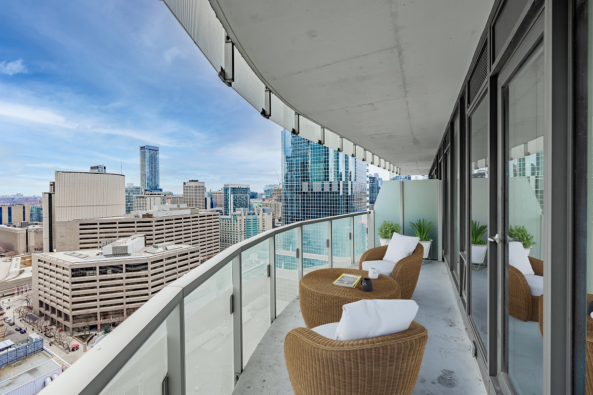 Condo balcony with patio furniture.