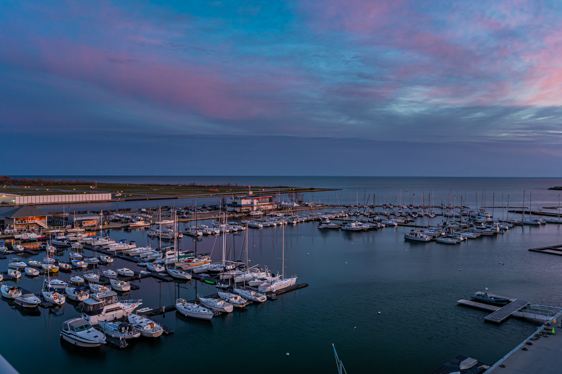 Boats and Lake Ontario during evening seen from 90 Stadium Rd #824 balcony.