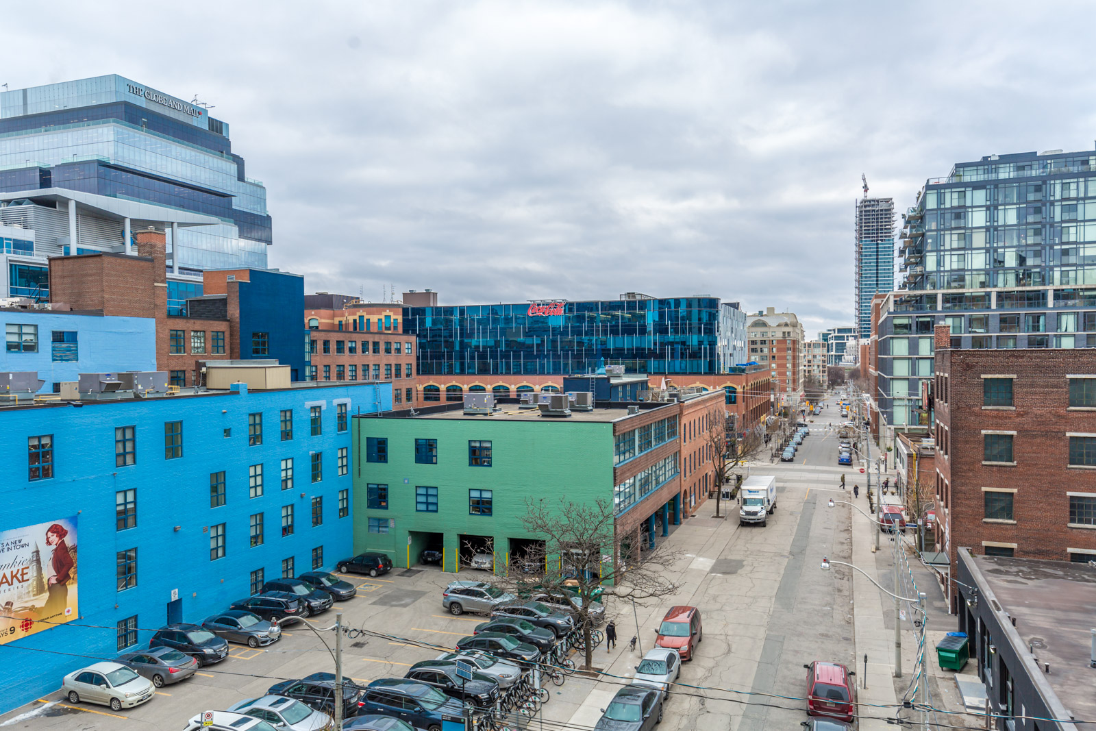 Balcony view from Ivory Condos of Sherbourne and Adelaide St in Moss Park with blue and green buildings.