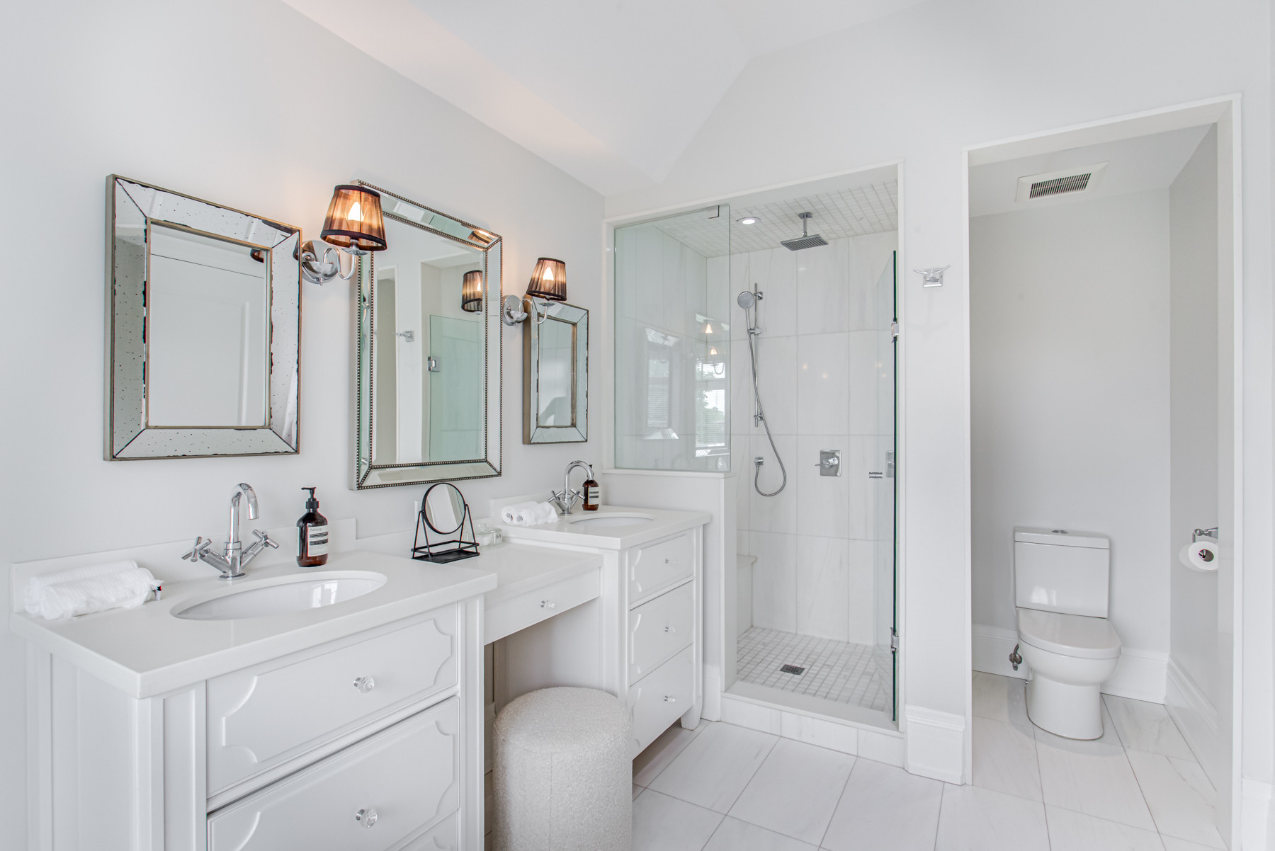 741 Glencairn Ave walk-in shower with frameless glass doors and marble walls.